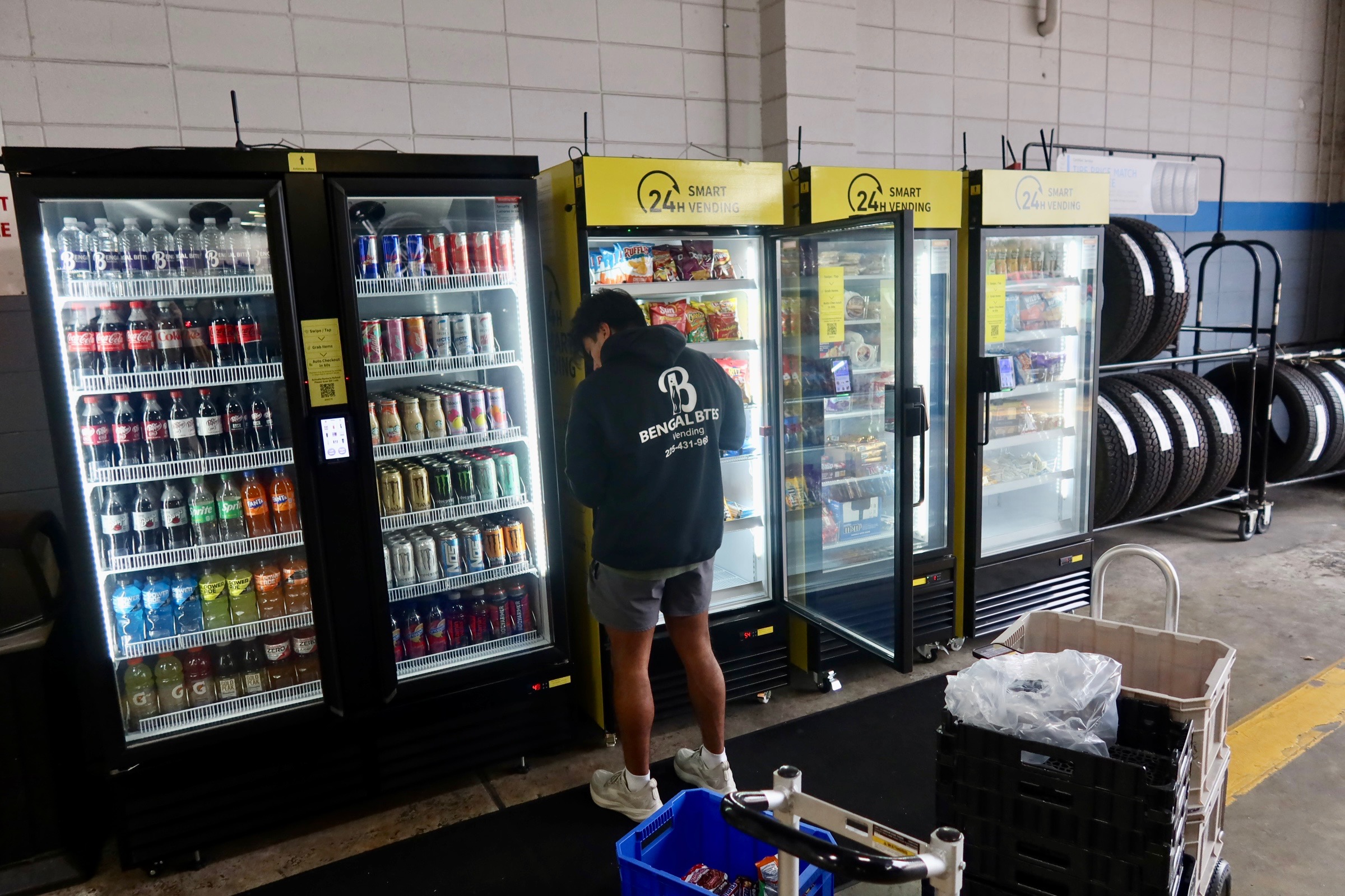 Bengal Bites team restocking a smart vending machine